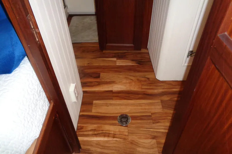 Ivory Lady Yacht Photos Pics Wooden interior flooring of a 1987 Hatteras 70 Cockpit Motor Yacht cabin.