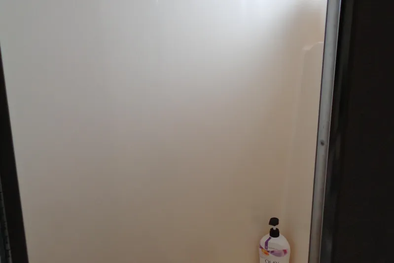 Ivory Lady Yacht Photos Pics Shower area inside 1987 Hatteras 70 Cockpit Motor Yacht with Olay body wash.