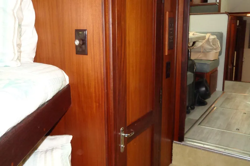 Ivory Lady Yacht Photos Pics Interior of 1987 Hatteras 70 Cockpit Motor Yacht with wooden door and bunk bed.