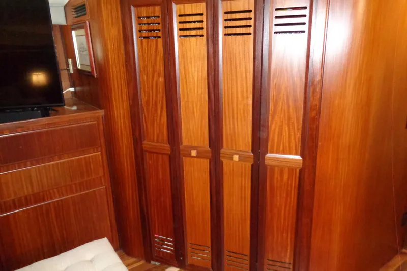 Ivory Lady Yacht Photos Pics Interior of 1987 Hatteras 70 Cockpit Motor Yacht with wooden cabinetry and storage.