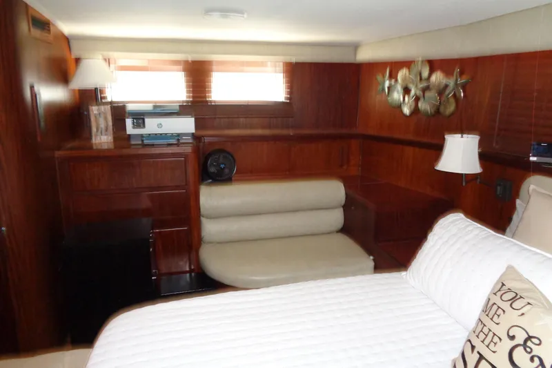 Ivory Lady Yacht Photos Pics Luxurious cabin interior of 1987 Hatteras 70 Cockpit Motor Yacht with elegant wood finish.