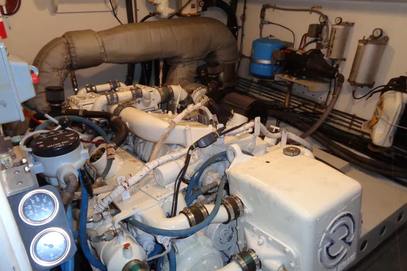 Ivory Lady Yacht Photos Pics Engine room of 1987 Hatteras 70 Cockpit Motor Yacht, showcasing mechanical components.