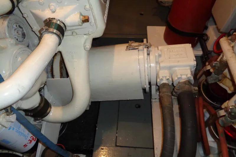 Ivory Lady Yacht Photos Pics Engine room of 1987 Hatteras 70 Cockpit Motor Yacht, showing mechanical components and piping.