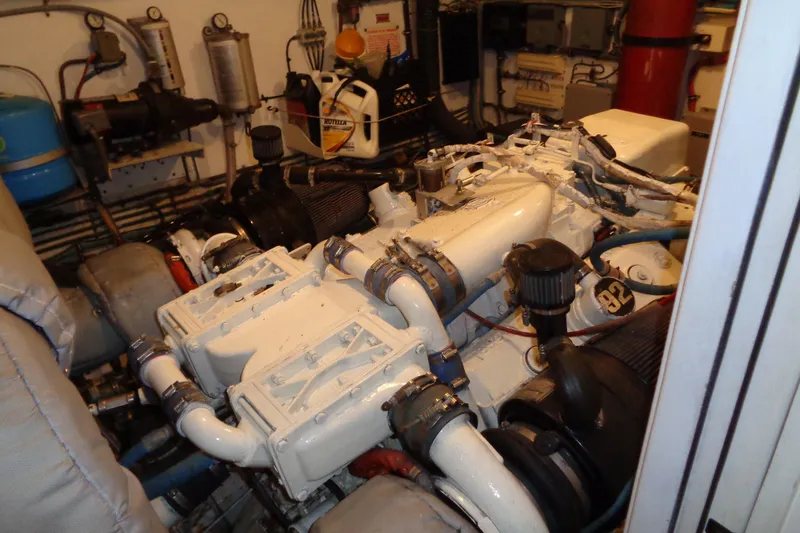 Ivory Lady Yacht Photos Pics Engine room of 1987 Hatteras 70 Cockpit Motor Yacht, showcasing mechanical components.