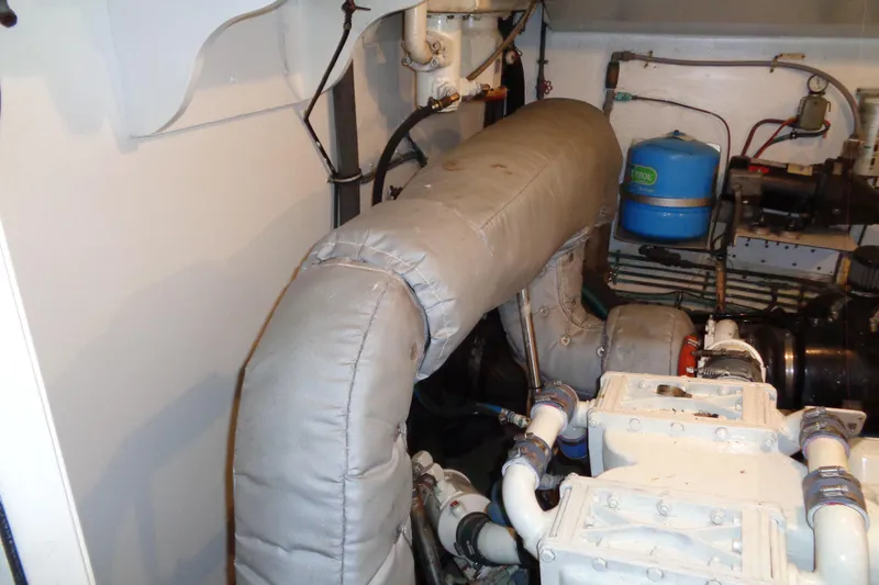 Ivory Lady Yacht Photos Pics Engine room of 1987 Hatteras 70 Cockpit Motor Yacht with insulated exhaust system.