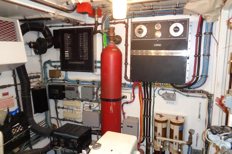 Ivory Lady Yacht Photos Pics Engine room of 1987 Hatteras 70 Cockpit Motor Yacht with control panels and wiring.