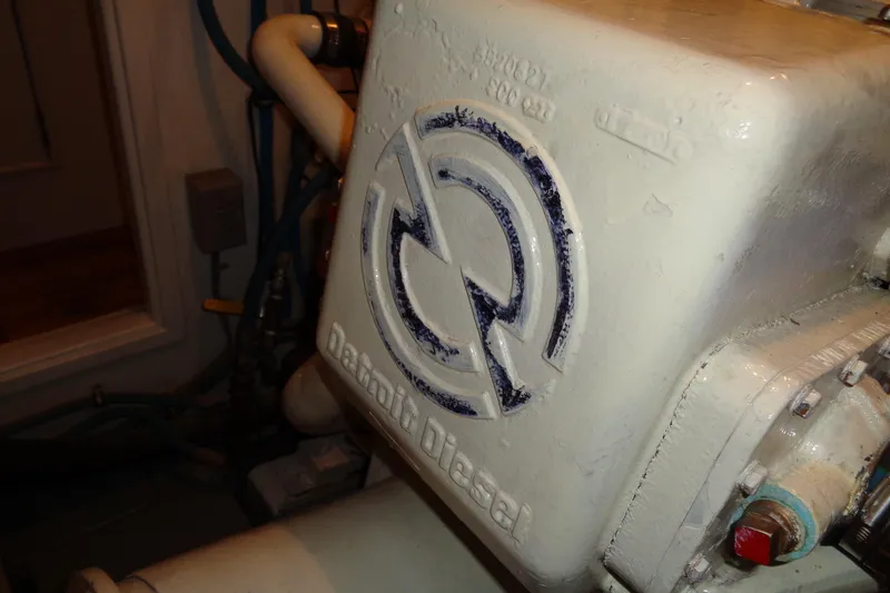 Ivory Lady Yacht Photos Pics Engine detail of a 1987 Hatteras 70 Cockpit Motor Yacht, featuring Detroit Diesel branding.