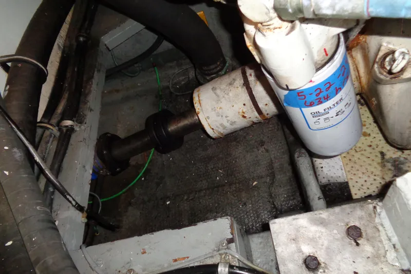 Ivory Lady Yacht Photos Pics Engine room of 1987 Hatteras 70 Cockpit Motor Yacht showing oil filter and components.