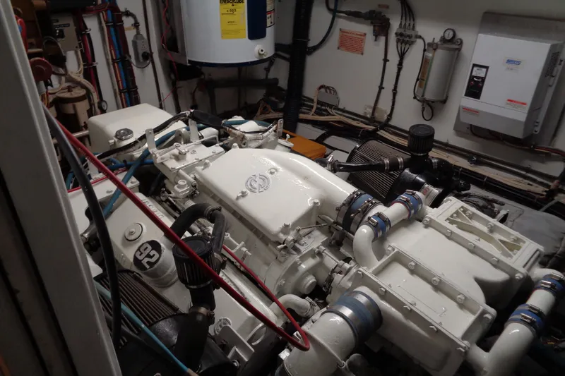 Ivory Lady Yacht Photos Pics Engine room of 1987 Hatteras 70 Cockpit Motor Yacht, showcasing mechanical components and piping.