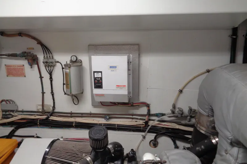 Ivory Lady Yacht Photos Pics Engine room of 1987 Hatteras 70 Cockpit Motor Yacht with control panel and wiring.