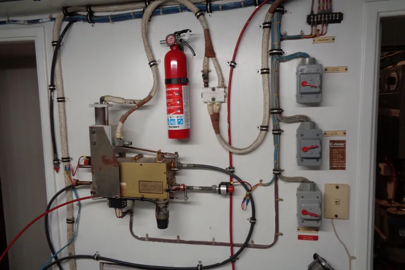 Ivory Lady Yacht Photos Pics Electrical panel and fire extinguisher on 1987 Hatteras 70 Cockpit Motor Yacht.