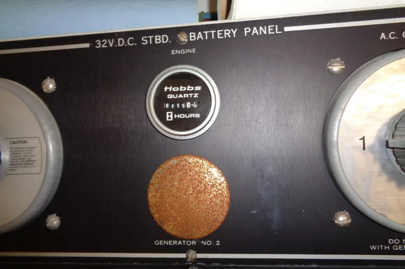 Ivory Lady Yacht Photos Pics Battery panel of 1987 Hatteras 70 Cockpit Motor Yacht with Hobbs quartz hour meter.