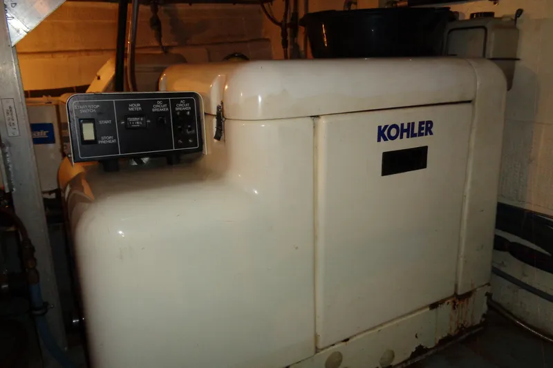 Ivory Lady Yacht Photos Pics Kohler generator in 1987 Hatteras 70 Cockpit Motor Yacht engine room.