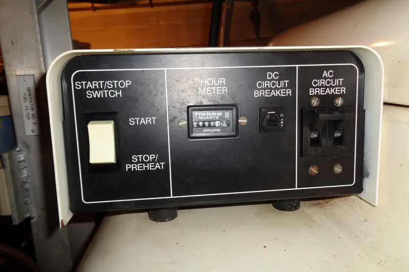 Ivory Lady Yacht Photos Pics Control panel of a 1987 Hatteras 70 Cockpit Motor Yacht with switches and hour meter.