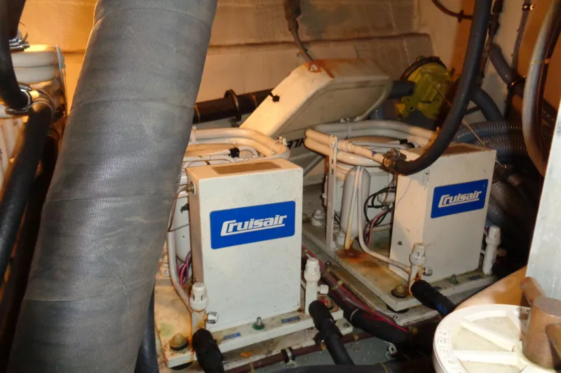 Ivory Lady Yacht Photos Pics Engine room of 1987 Hatteras 70 Cockpit Motor Yacht with Cruisair units.