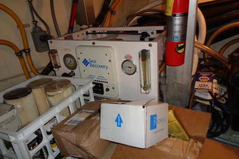 Ivory Lady Yacht Photos Pics Engine room of 1987 Hatteras 70 Cockpit Motor Yacht with Sea Recovery system and equipment.