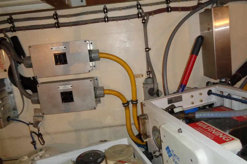 Ivory Lady Yacht Photos Pics Engine room of 1987 Hatteras 70 Cockpit Motor Yacht with electrical components and wiring.