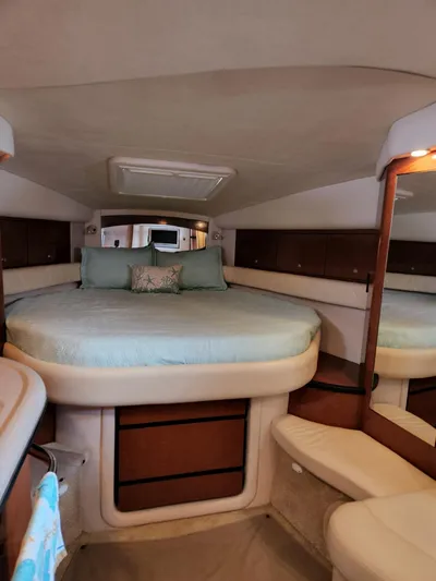  Yacht Photos Pics 2005 Sea Ray 340 Sundancer cabin with cozy bed and elegant interior design.