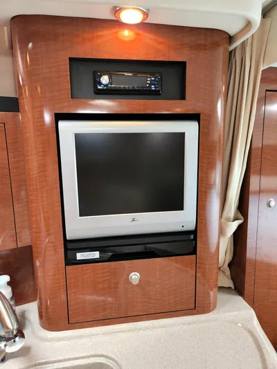  Yacht Photos Pics 2005 Sea Ray 340 Sundancer interior with built-in TV and stereo system.