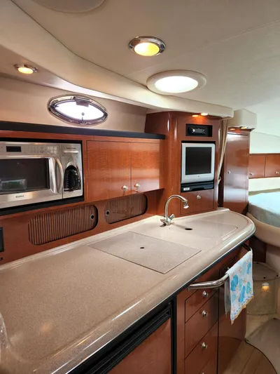  Yacht Photos Pics Luxurious 2005 Sea Ray 340 Sundancer yacht interior with modern kitchen amenities.