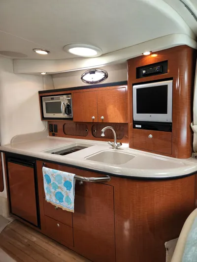 Yacht Photos Pics Luxurious 2005 Sea Ray 340 Sundancer yacht interior with modern kitchen amenities.