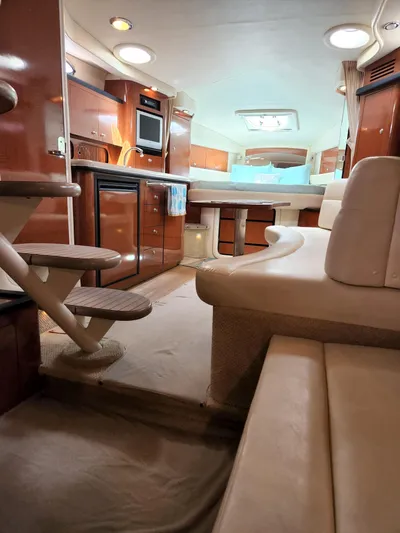 Yacht Photos Pics Interior of 2005 Sea Ray 340 Sundancer yacht with luxurious seating and kitchenette.