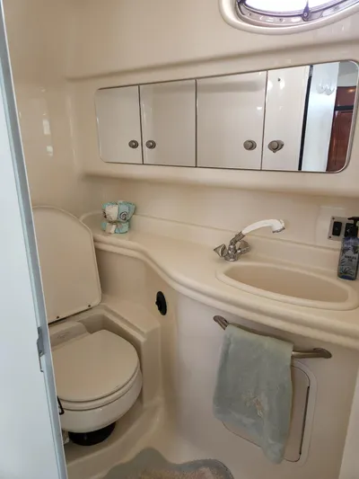  Yacht Photos Pics 2005 Sea Ray 340 Sundancer bathroom with sink, mirror, and toilet.