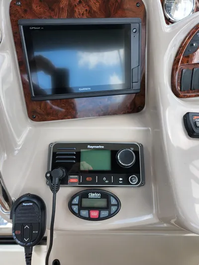  Yacht Photos Pics Control panel of 2005 Sea Ray 340 Sundancer with Garmin and Raymarine electronics.