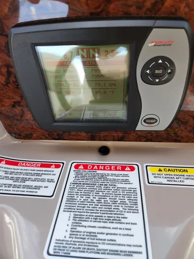  Yacht Photos Pics 2005 Sea Ray 340 Sundancer dashboard with navigation display and safety warnings.