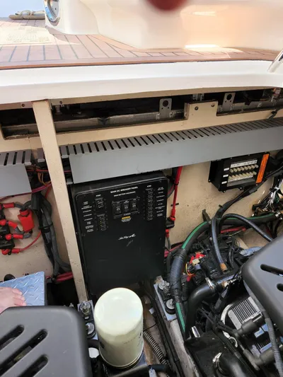  Yacht Photos Pics Engine compartment of a 2005 Sea Ray 340 Sundancer boat, showing electrical panel and components.