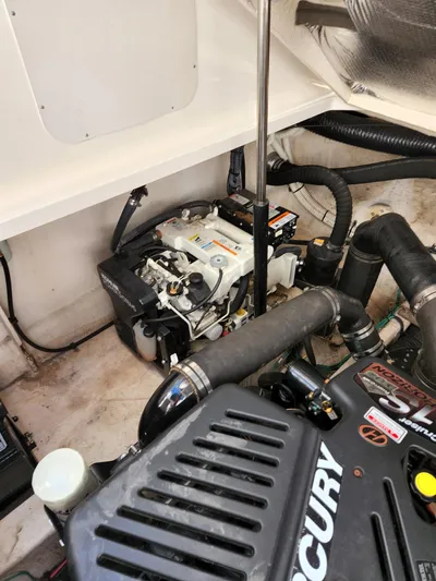  Yacht Photos Pics Engine compartment of a 2005 Sea Ray 340 Sundancer boat, featuring Mercury components.