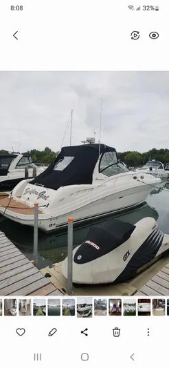  Yacht Photos Pics 2005 Sea Ray 340 Sundancer docked, covered, with a Sea-Doo GTX nearby.