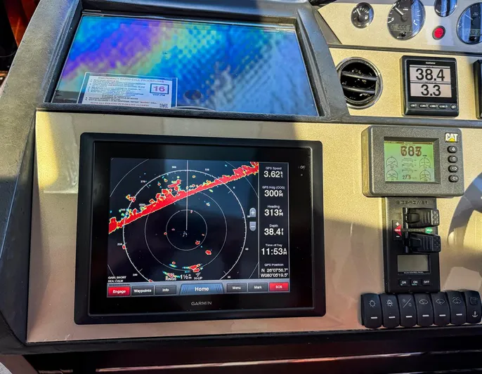 Bottoms Up Yacht Photos Pics Control panel of 2015 Princess V52 yacht with navigation and radar display.