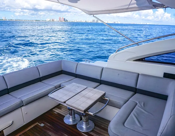 Bottoms Up Yacht Photos Pics Luxury seating area on 2015 Princess V52 yacht with ocean view.