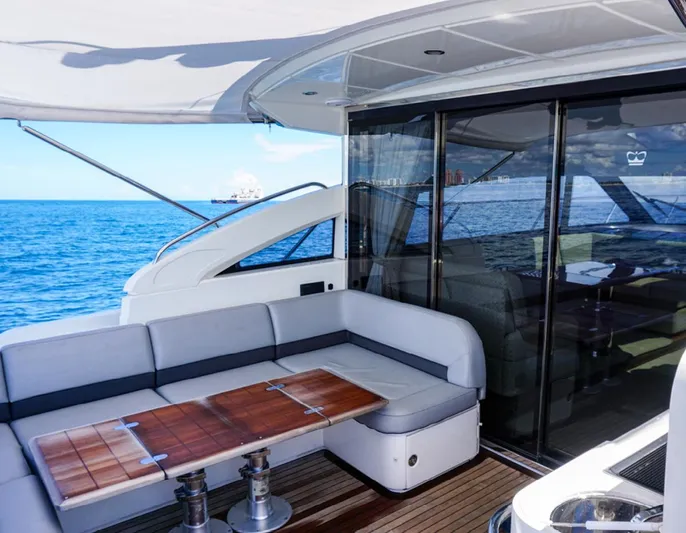 Bottoms Up Yacht Photos Pics Luxurious 2015 Princess V52 yacht with elegant seating and ocean view.
