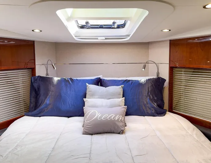 Bottoms Up Yacht Photos Pics Luxurious 2015 Princess V52 yacht bedroom with skylight and plush bedding.
