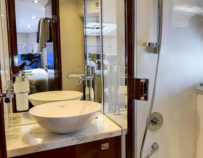 Bottoms Up Yacht Photos Pics Luxurious bathroom in 2015 Princess V52 yacht with modern sink and shower.
