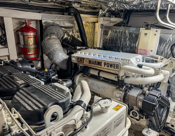 Bottoms Up Yacht Photos Pics Engine room of 2015 Princess V52 yacht with CAT Marine Power engine.