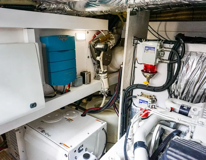 Bottoms Up Yacht Photos Pics Engine room of 2015 Princess V52 yacht, showcasing mechanical components and wiring.