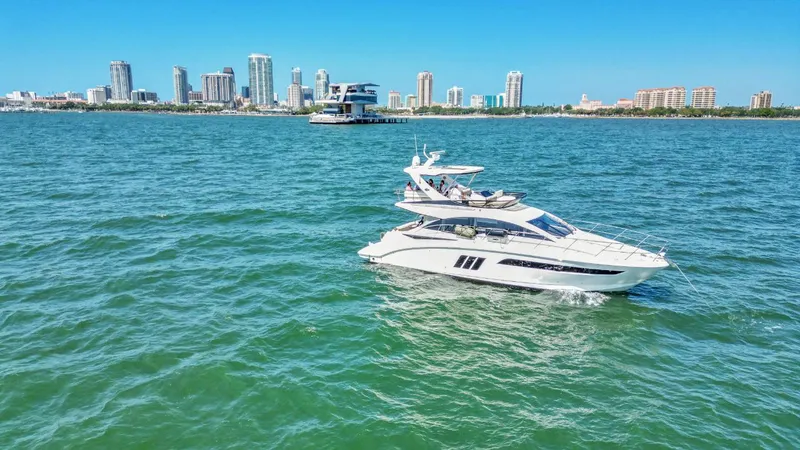  Yacht Photos Pics 2015 Sea Ray 510 Fly yacht cruising near city skyline on a sunny day.