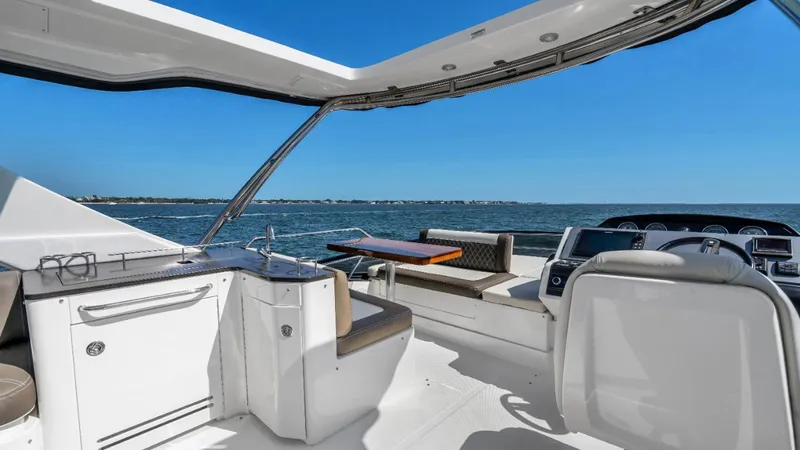  Yacht Photos Pics 2015 Sea Ray 510 Fly yacht interior with seating, table, and ocean view.