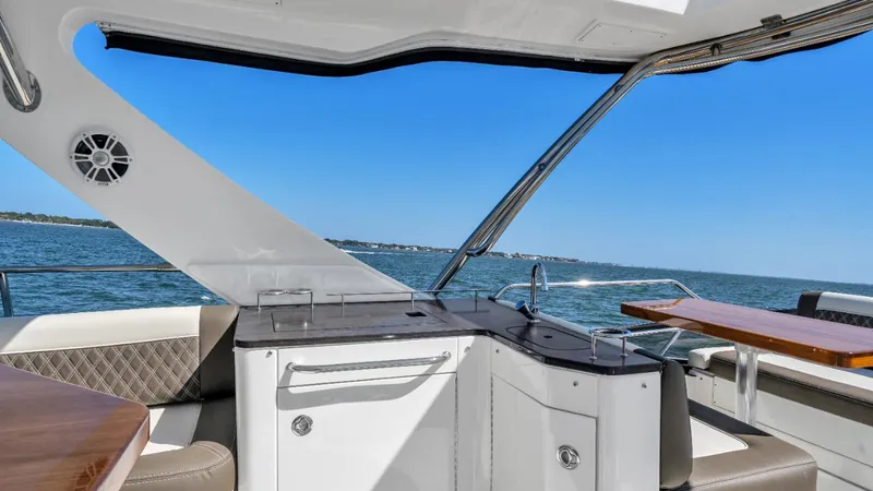  Yacht Photos Pics 2015 Sea Ray 510 Fly yacht interior with ocean view, featuring sleek design and modern amenities.