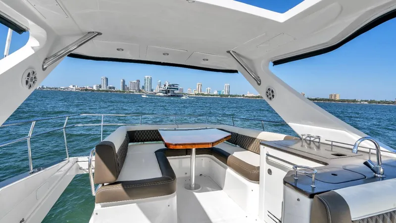  Yacht Photos Pics Luxurious 2015 Sea Ray 510 Fly yacht interior with ocean view and city skyline.