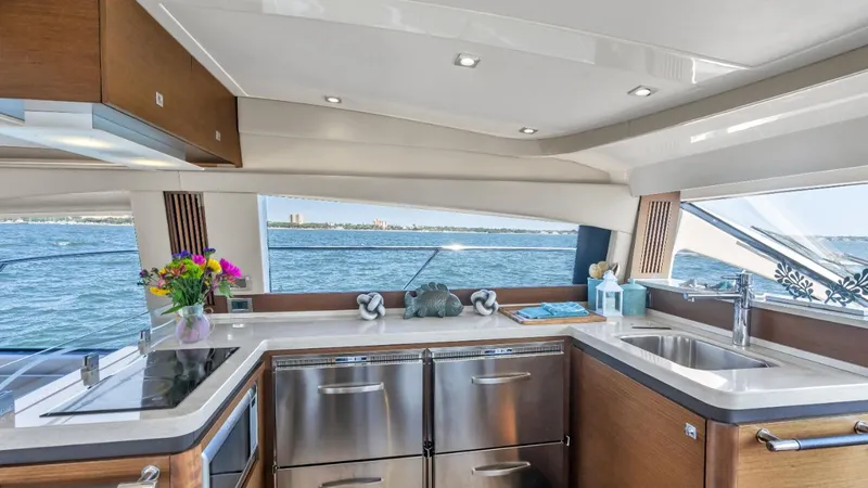  Yacht Photos Pics Luxurious kitchen interior of 2015 Sea Ray 510 Fly yacht with ocean view.