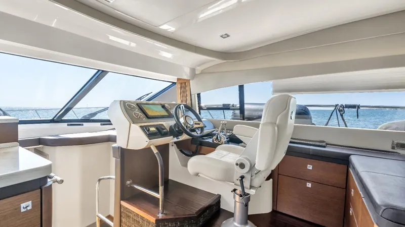  Yacht Photos Pics 2015 Sea Ray 510 Flybridge interior with modern helm and panoramic windows.
