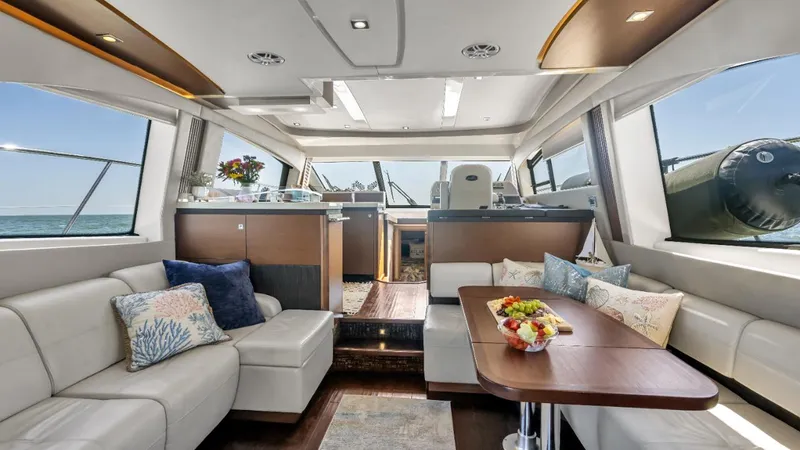  Yacht Photos Pics Luxurious interior of 2015 Sea Ray 510 Fly yacht with elegant seating and dining area.
