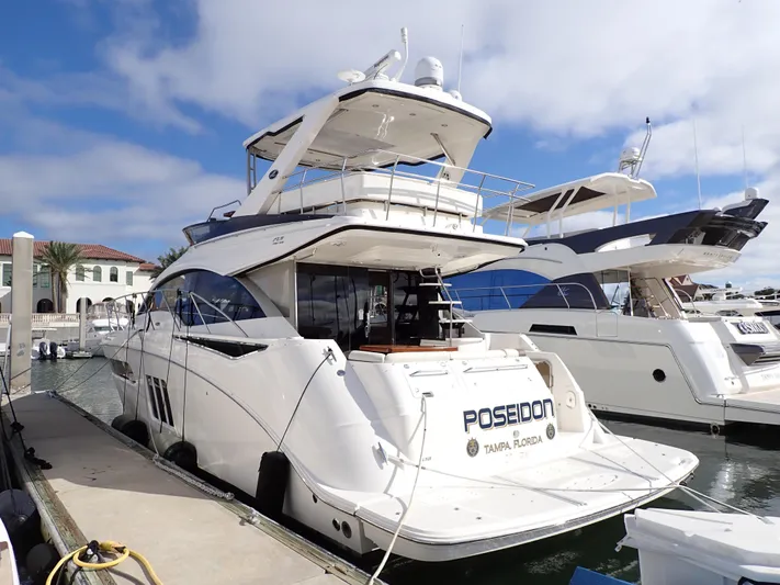  Yacht Photos Pics 2015 Sea Ray 510 Fly yacht docked at marina, sunny day, luxury vessel.