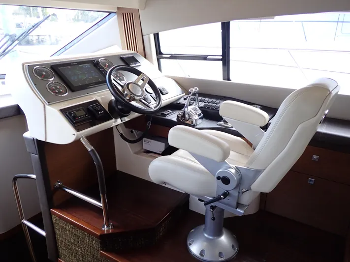  Yacht Photos Pics Helm station of 2015 Sea Ray 510 Fly yacht with modern controls and captain's chair.