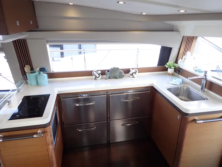  Yacht Photos Pics Luxurious kitchen interior of 2015 Sea Ray 510 Fly yacht with modern appliances.
