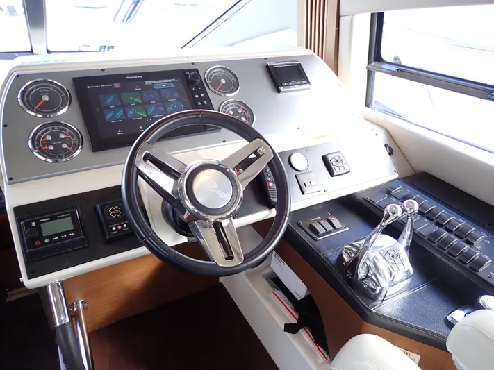  Yacht Photos Pics Helm of 2015 Sea Ray 510 Fly yacht with modern controls and navigation system.